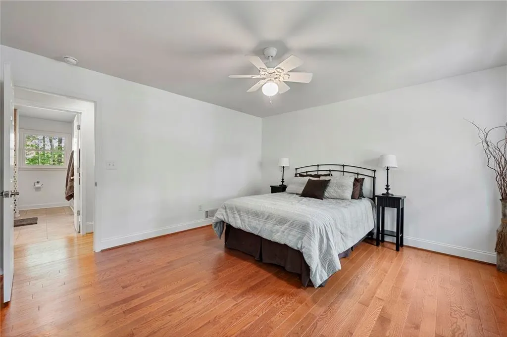 Bedroom featuring light wood-style floors and baseboards