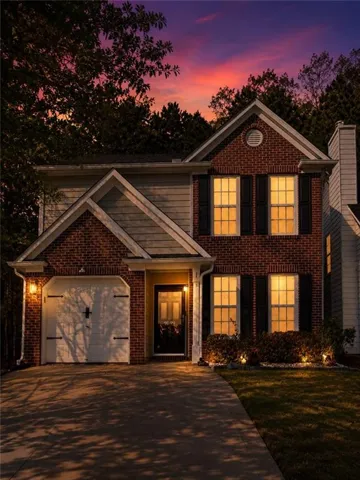 Brick and siding exterior with a gabled roofline