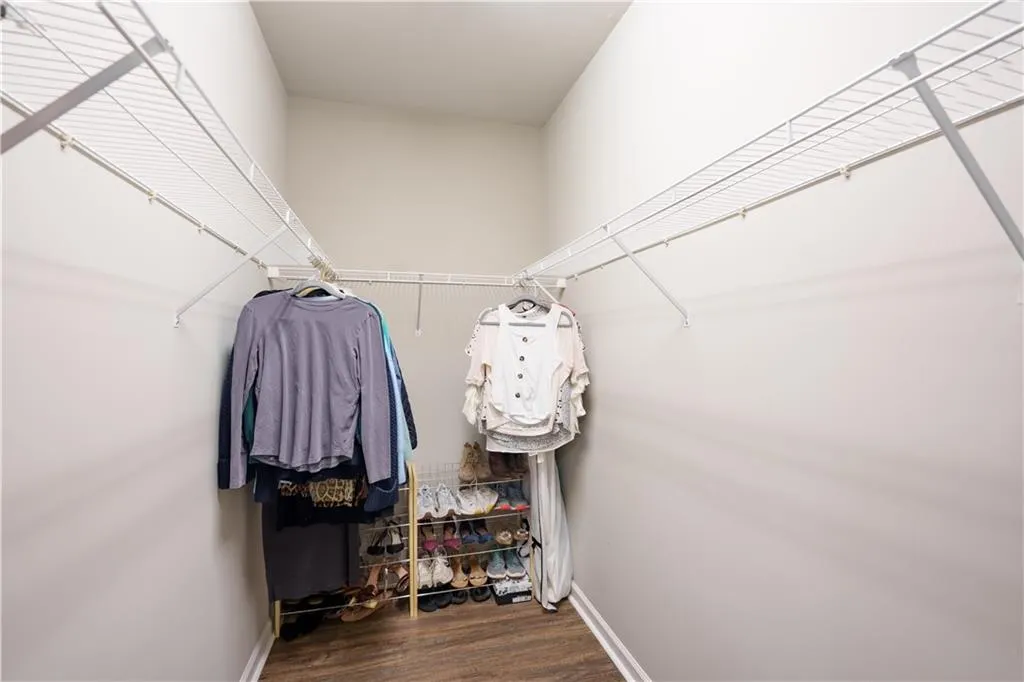 Spacious closet featuring wood finished floors