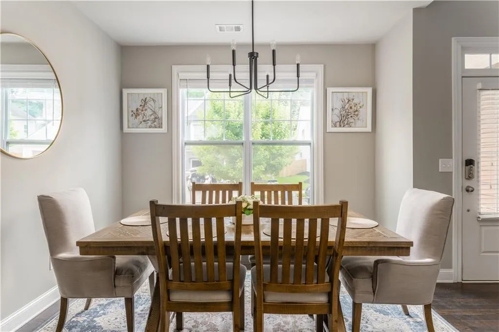 Dining room with dark wood finished floors