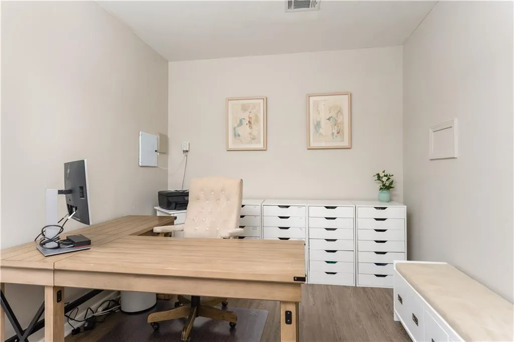 Office with wood finished floors