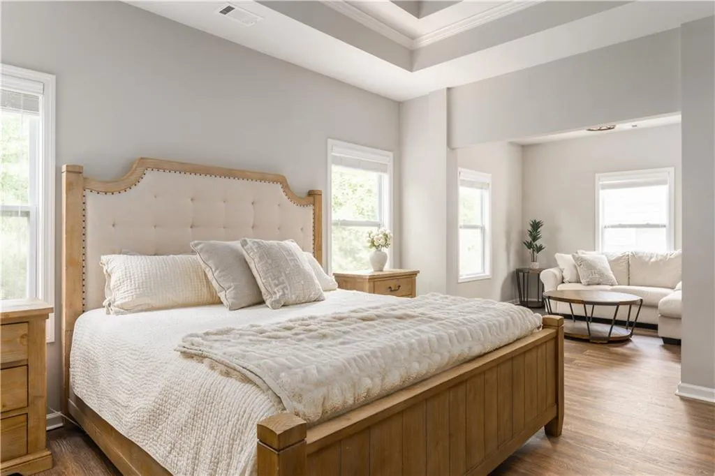 Bedroom with dark wood-type flooring and ornamental molding