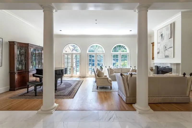 Formal living room opening to pool area