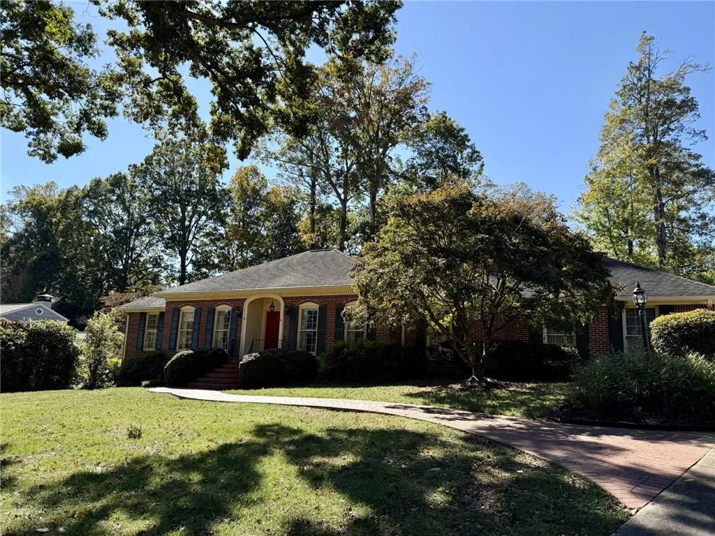 Gated driveway with rear entry 2 car garage.