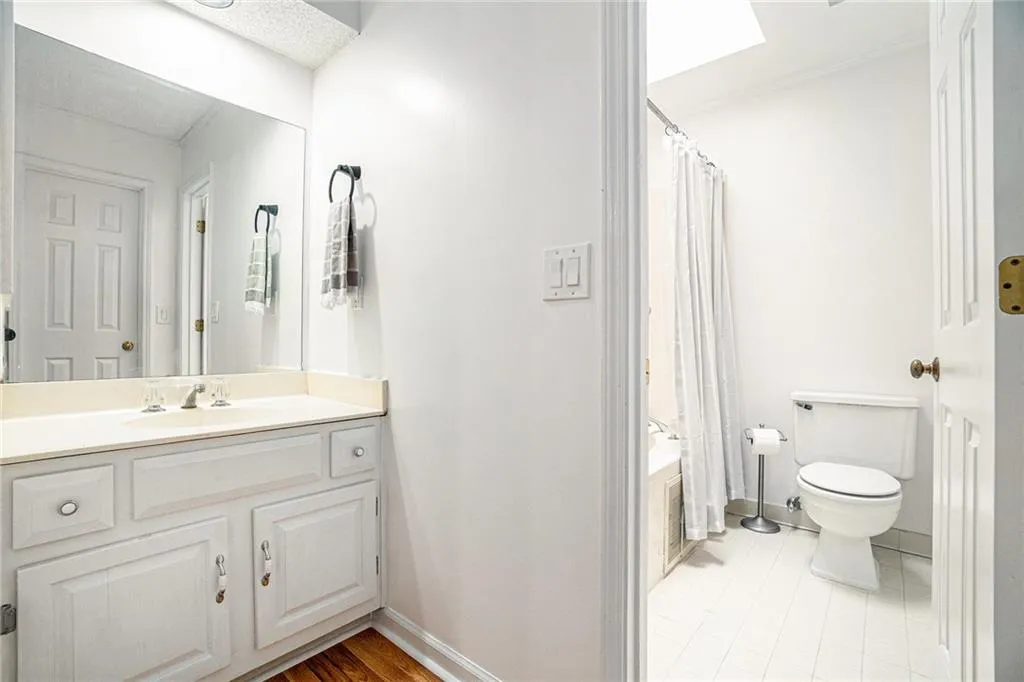 Bathroom with vanity and tiled shower / bath combo Bathroom with vanity and tiled shower / bath combo