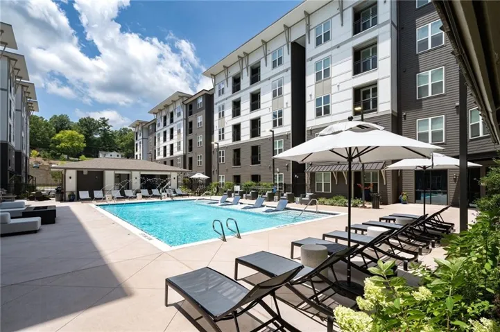 Community pool with a patio area