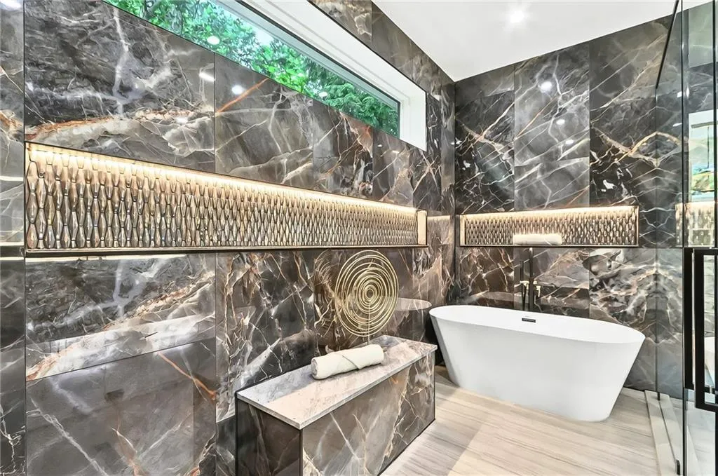 Bathroom with tile walls and a soaking tub