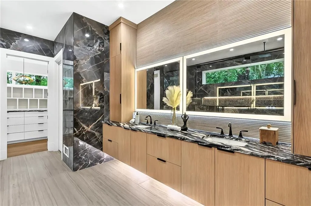 Featuring a sink, decorative backsplash, and recessed lighting