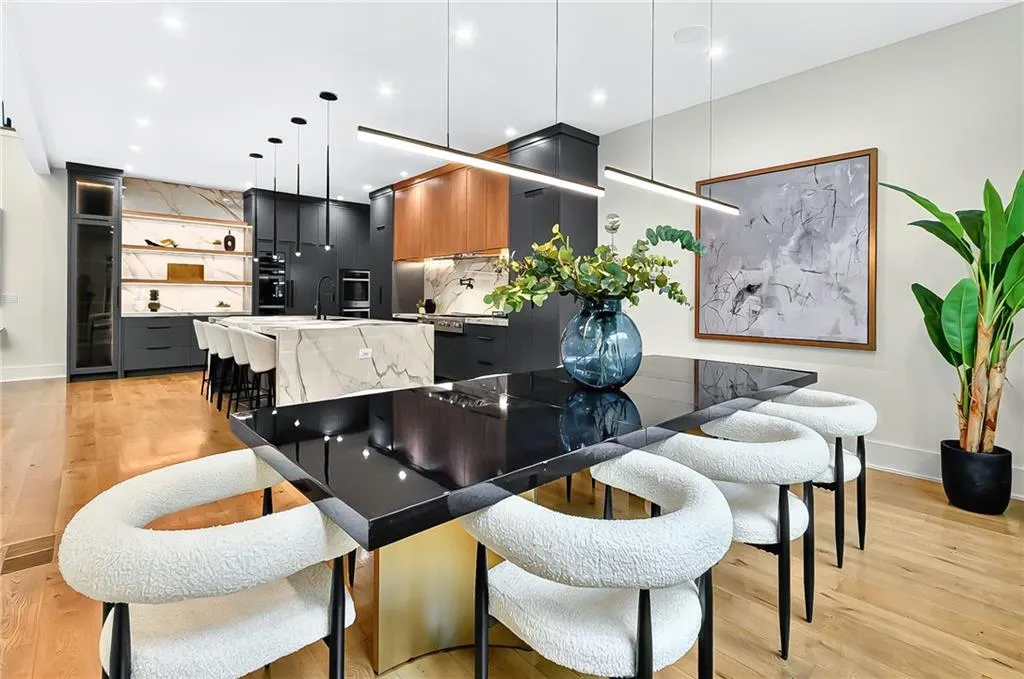 Dining room featuring light wood-type flooring and baseboards