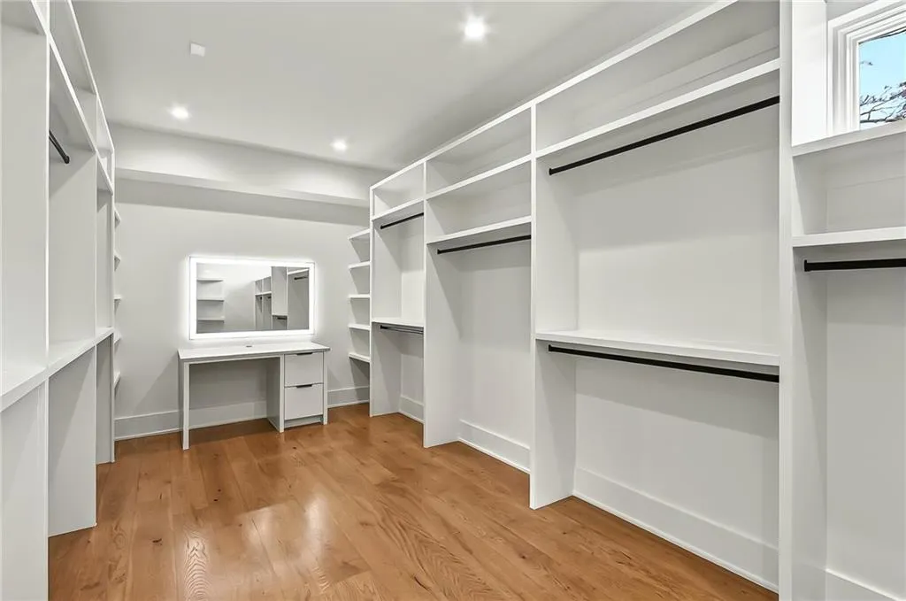 Walk in closet featuring light wood-type flooring