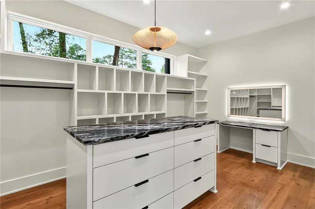 Spacious closet featuring light wood-style floors