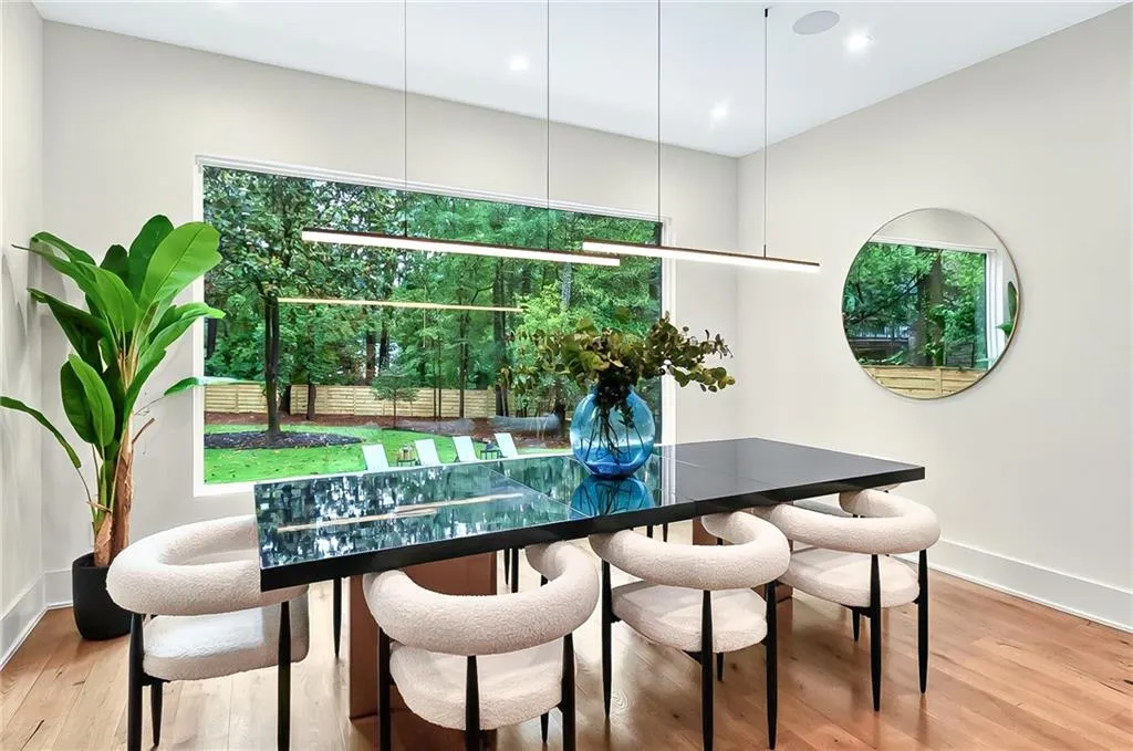 Dining space featuring light wood-style floors, baseboards, and recessed lighting