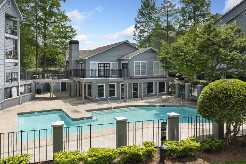 Community pool with a patio