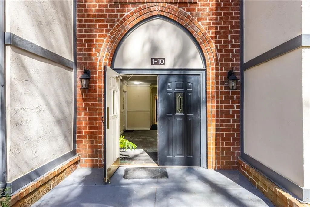 Property entrance with brick siding