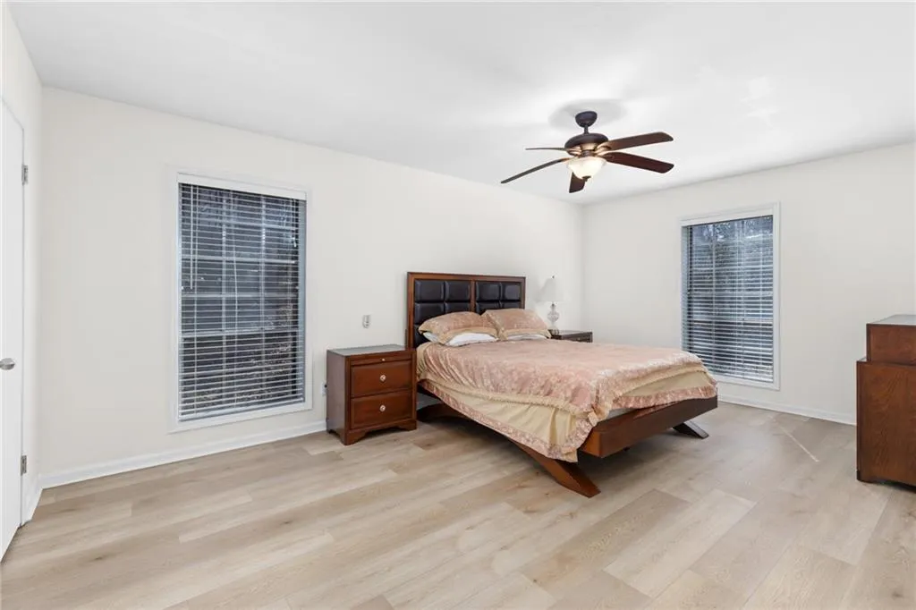 Bedroom featuring light wood finished floors and ceiling fan