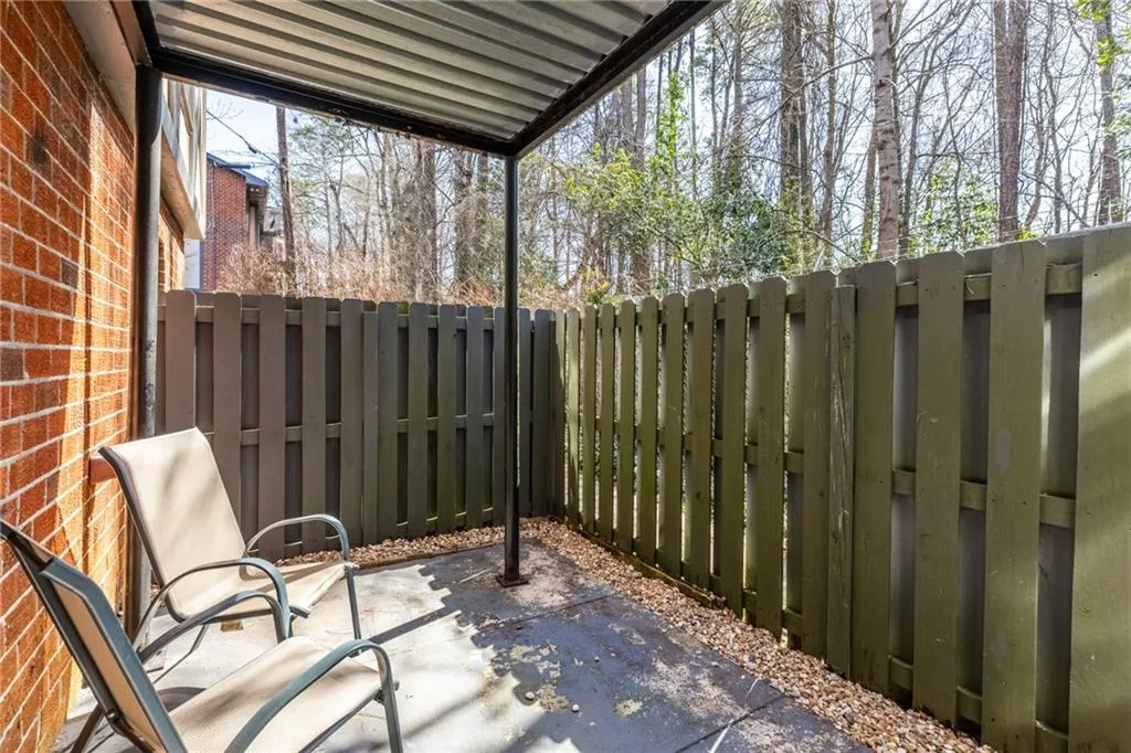 Fenced backyard with a patio area