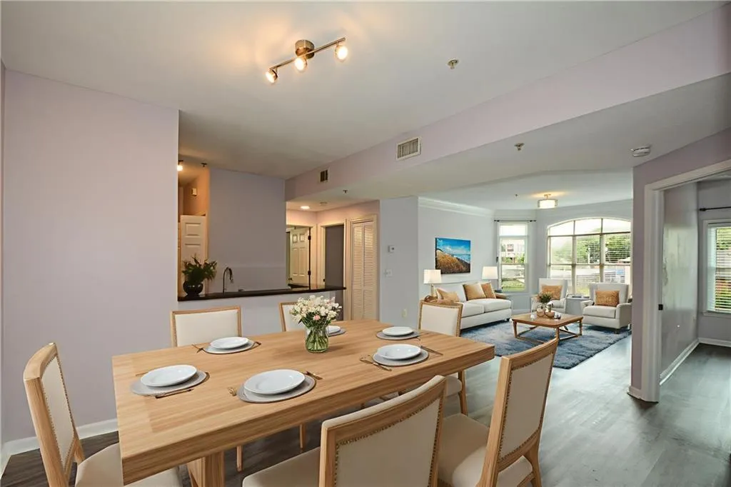 Dining space featuring wood finished floors and baseboards