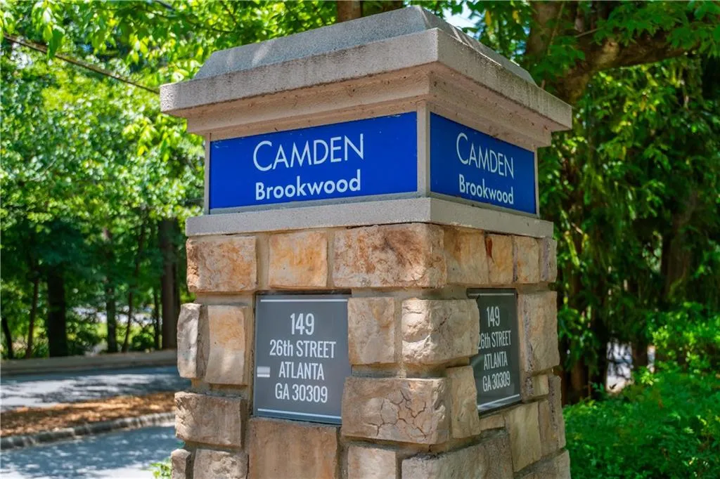 Stone-clad monument sign with a rectangular cap