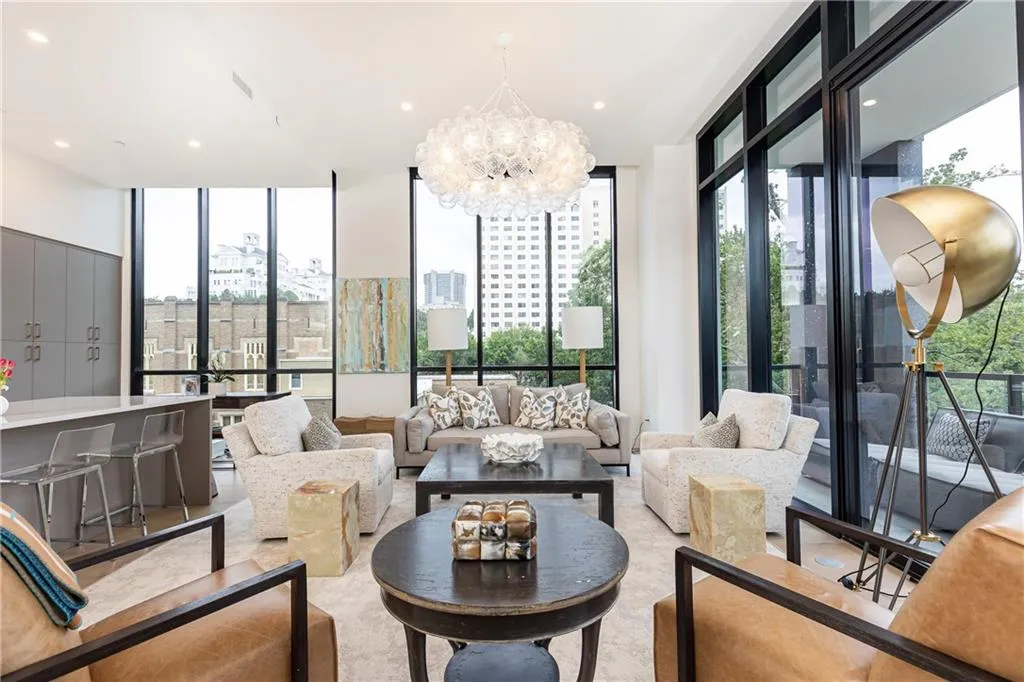 Floor to ceiling windows and 12' ceilings provide lots of natural light and an airy feel.