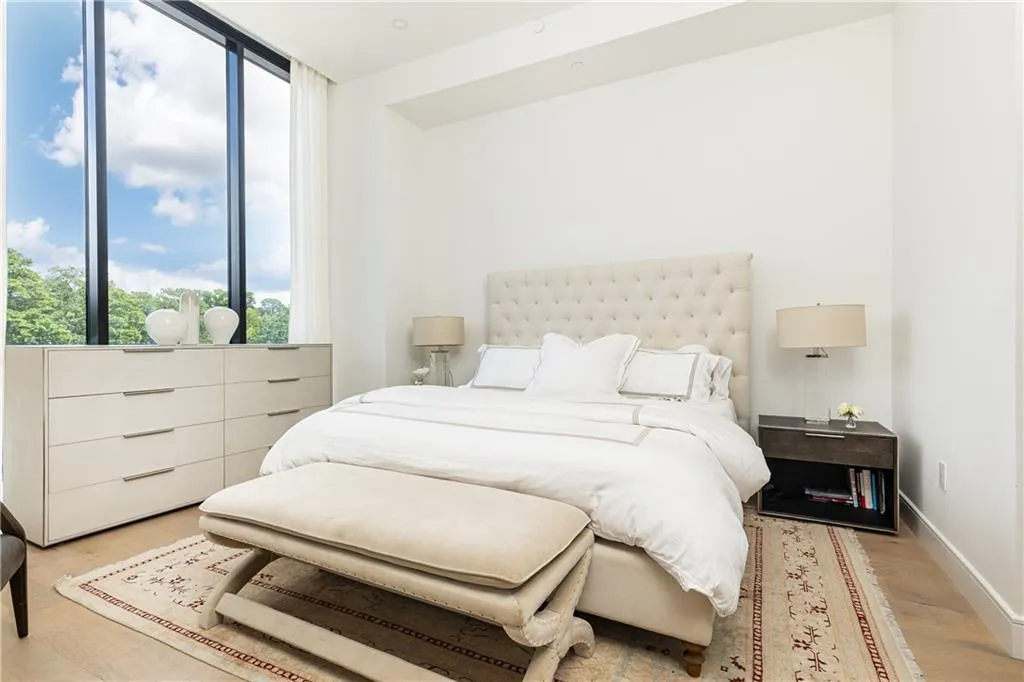 The beautiful primary suite welcomes the morning sun.