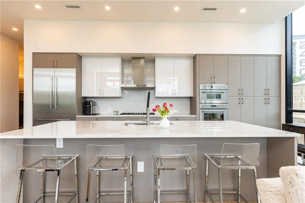 The kitchen features additional shelving, drawers and cabinetry by Italia added by the sellers. Such thoughful storage details aren't found in standard units.