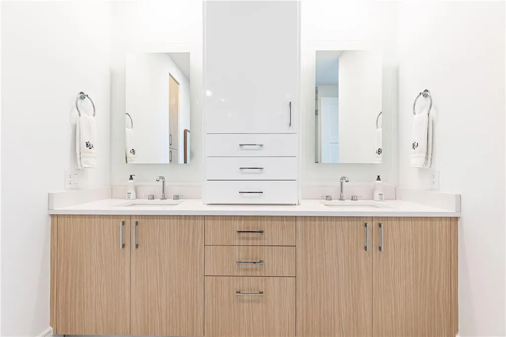 Exclusive upgrades in this unit include this personal double vanity with additional storage space added uniquely by the sellers.