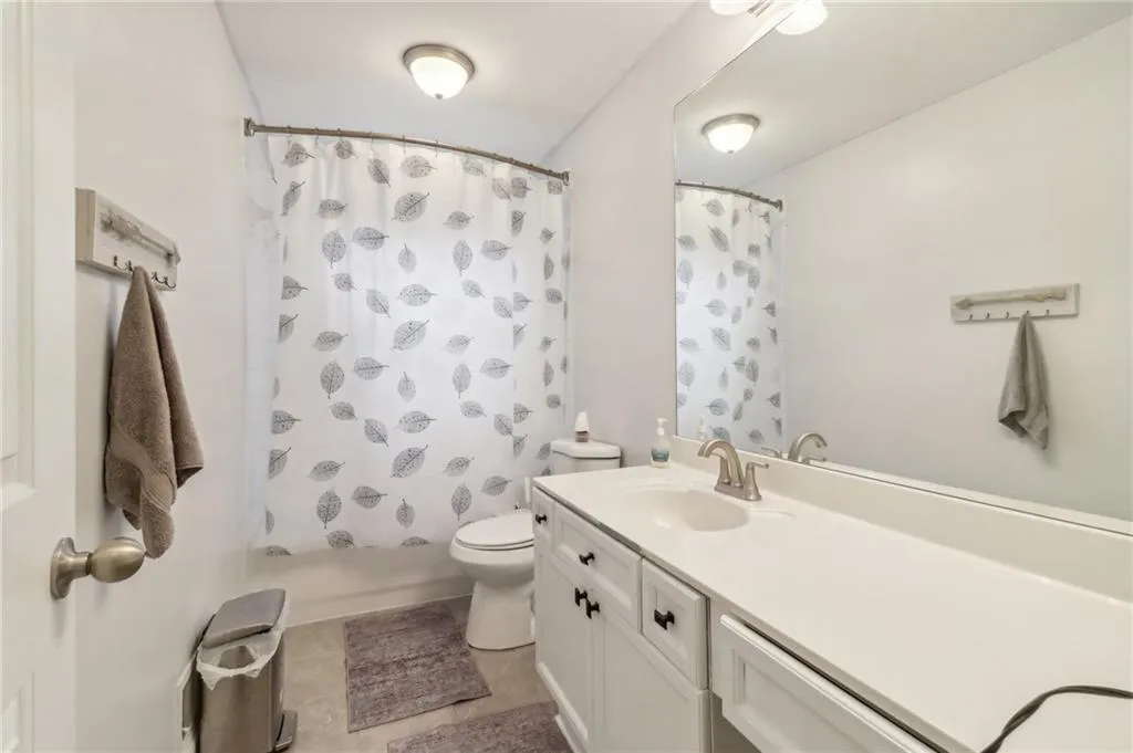 Bathroom with vanity, toilet, and tile patterned floors Bathroom with vanity, toilet, and tile patterned floors