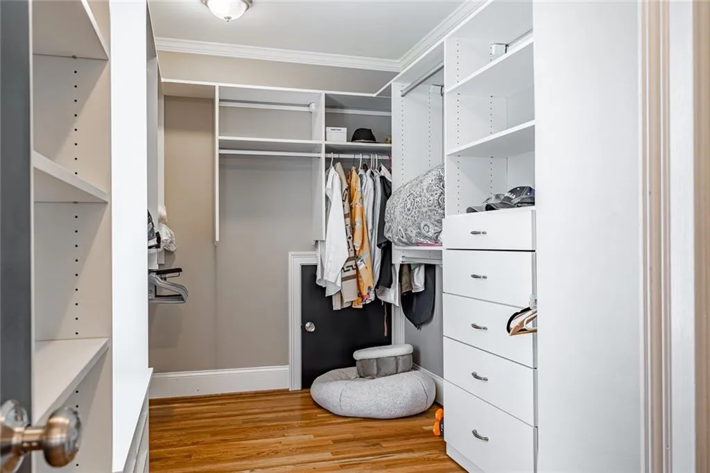 Primary bedroom walk in closet