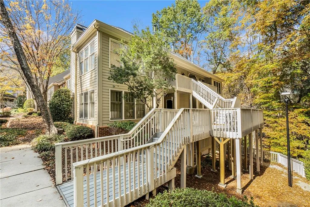 Back of house featuring a wooden deck