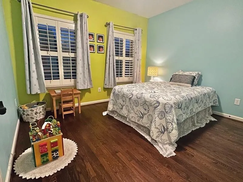 Bedroom featuring dark hardwood / wood-style flooring