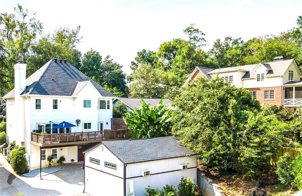 Back of Home with large Patio and Extra Garage/ Shed