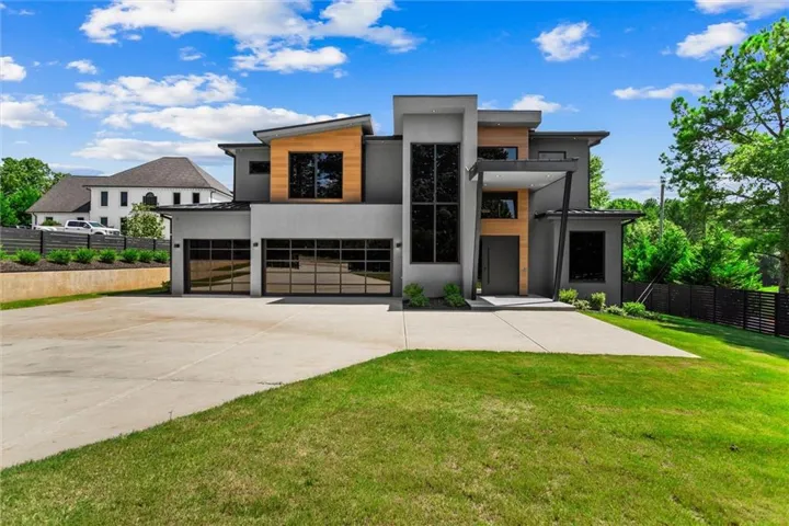 Modernist exterior with multi-level roofline and wood-finish accents