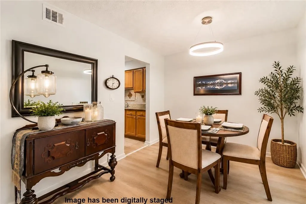Spacious dining area conveniently located just off the kitchen, with plenty of room for everyday meals or entertaining.