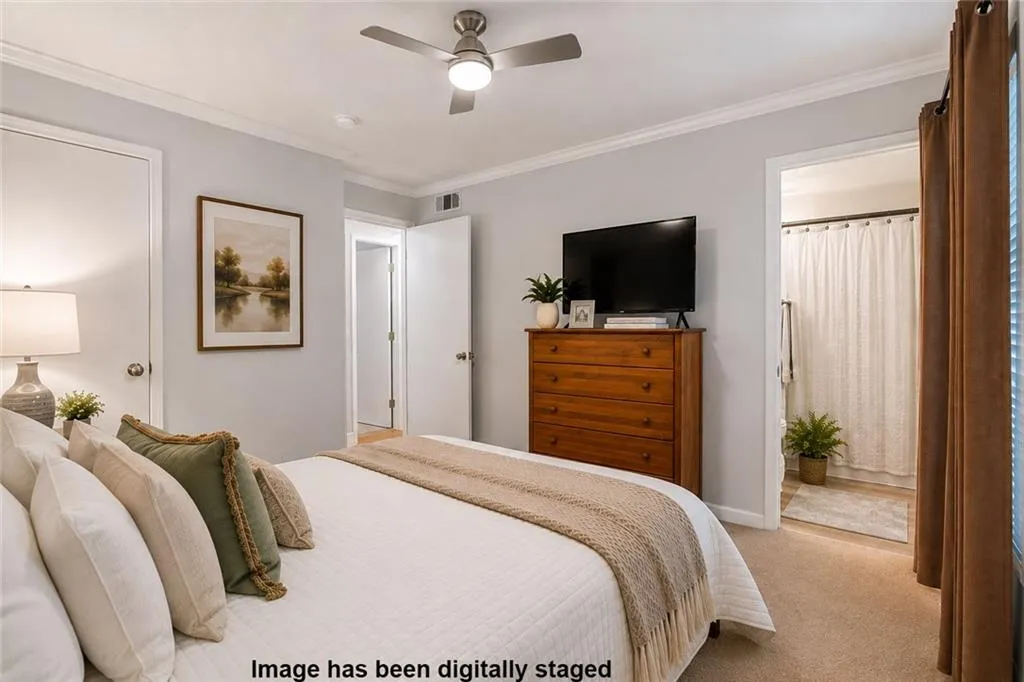 Comfortable primary bedroom with plenty of space for a king-size bed and additional furnishings w/adjoining private bath.