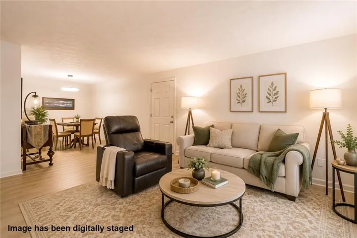 Comfortable living room flows easily into the dining area, creating an open and connected feel. Generous space for relaxing, entertaining, and everyday living.