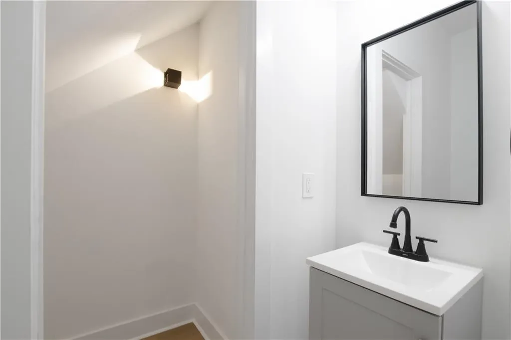 Bathroom featuring vanity and baseboards