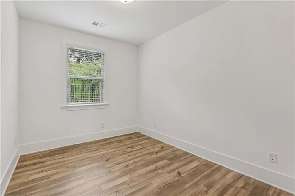 Empty room with light wood-style floors