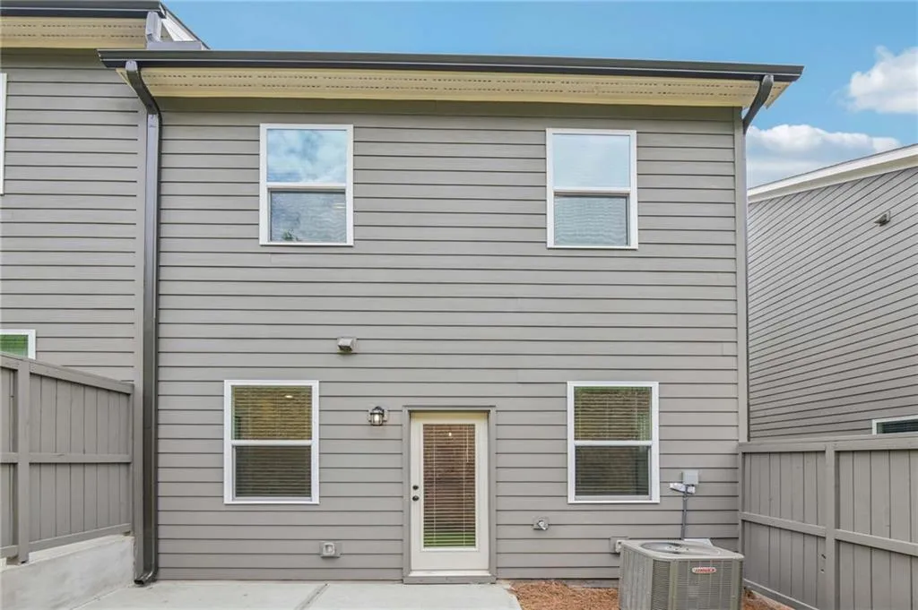 Back of house with a patio area