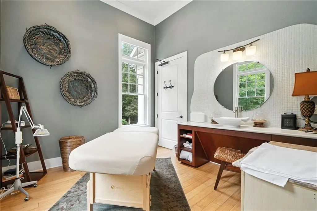 Bathroom with vanity, wood finished floors, and decorative backsplash