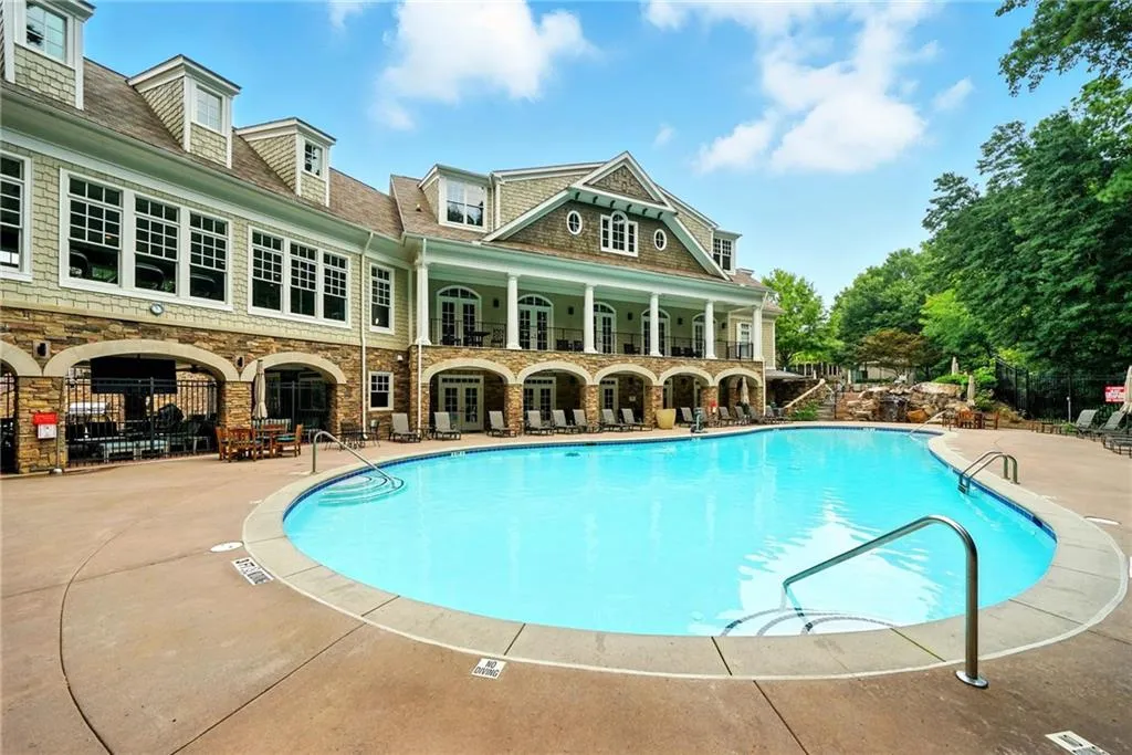 Community pool featuring a patio