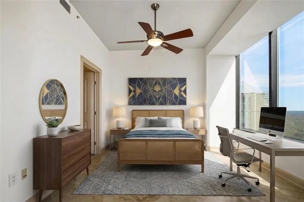 High ceilings with recessed lighting and a ceiling fan, floor-to-ceiling windows, and warm wood-finish flooring
