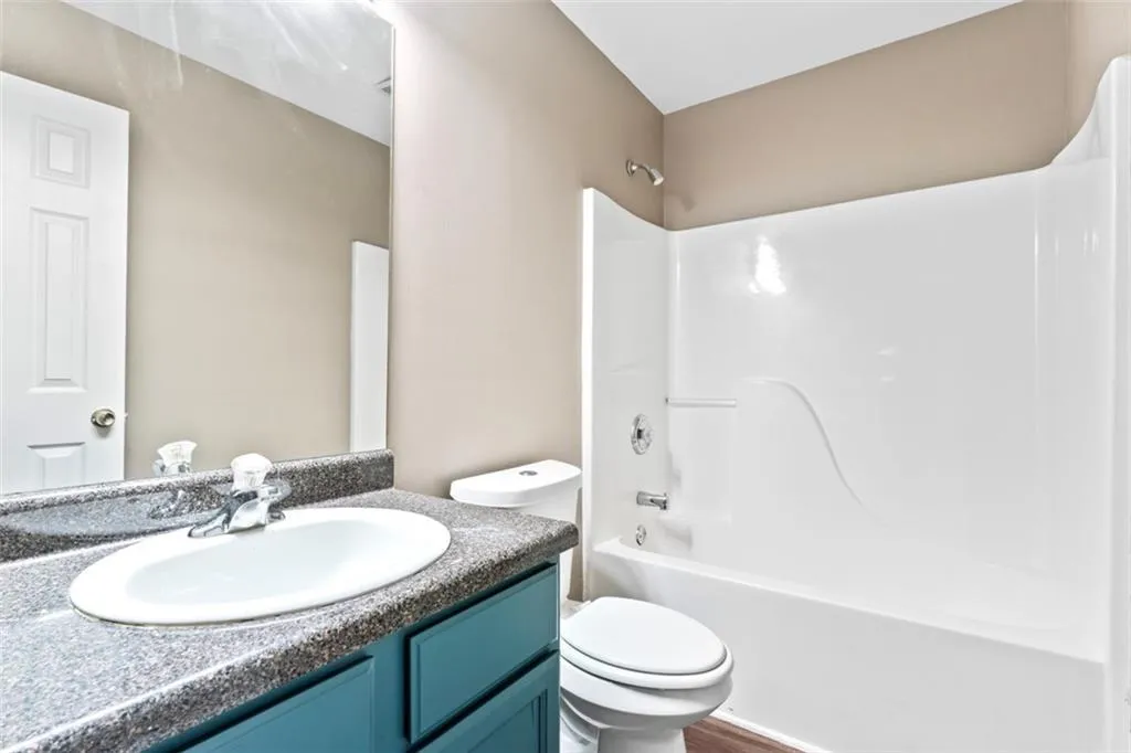 Bathroom with vanity and shower / bath combination