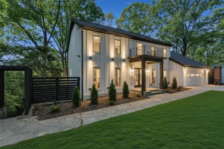Modern farmhouse exterior with white board and batten siding