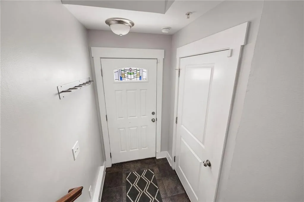 right in inside the front door/ garage space