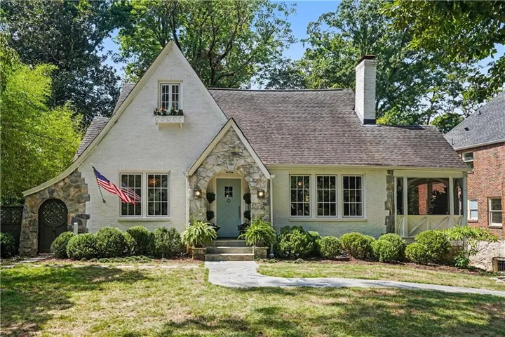 Stucco exterior with stone accents, a prominent front gable, and a covered front entry