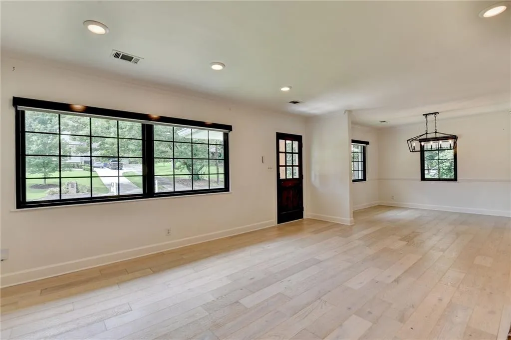 Entryway featuring crown molding, light wood-style flooring, and recessed lighting