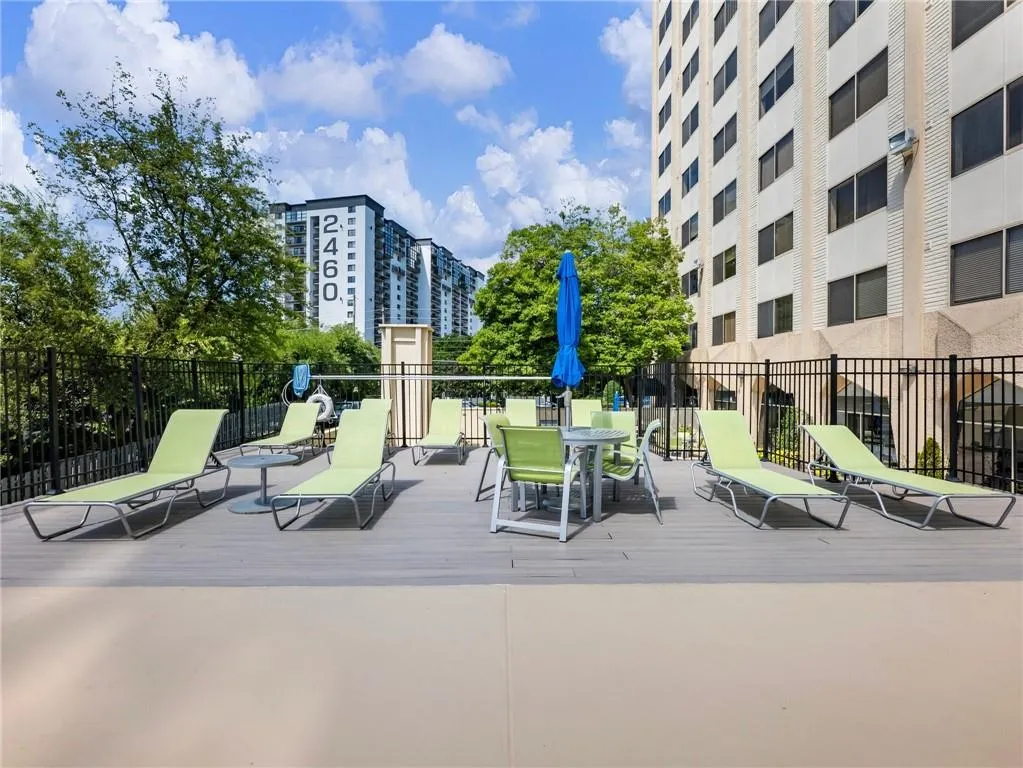 Beautiful Greenery in Late Summer! Loungers, Tables, Umbrellas & Chairs located in the gated Pool area