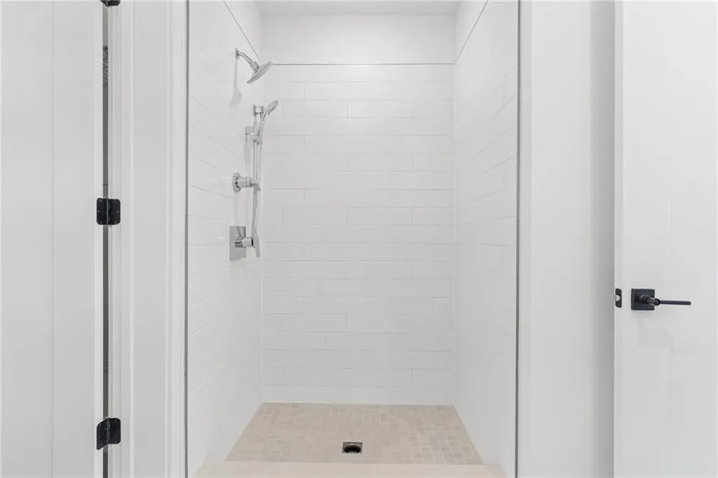 Full bathroom with tiled shower