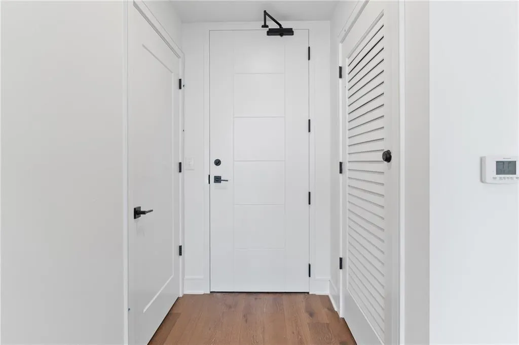 Hallway featuring wood finished floors