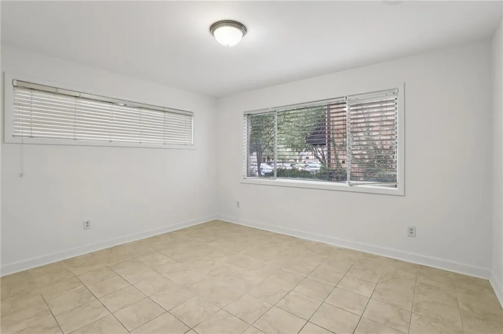 Empty room featuring light tile patterned floors